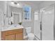 Neutral bathroom with glass-enclosed shower, vanity, and bright natural light at 1160 Craigmeade Dr, Morrisville, NC 27560