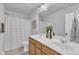 Bathroom with double sinks, a mirror, and a shower with a curtain creating a functional space at 1160 Craigmeade Dr, Morrisville, NC 27560