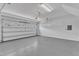 Spacious two car garage with an epoxy floor and a sealed garage door at 1160 Craigmeade Dr, Morrisville, NC 27560