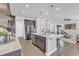 Stylish kitchen with dark cabinets, stainless steel appliances, and an island with seating for casual dining at 1160 Craigmeade Dr, Morrisville, NC 27560