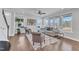 Inviting living room featuring hardwood floors, neutral paint and large windows providing ample natural light at 1160 Craigmeade Dr, Morrisville, NC 27560