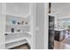 Walk-in pantry with bright white shelving next to kitchen at 1160 Craigmeade Dr, Morrisville, NC 27560