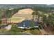 An aerial view of golf course and clubhouse, featuring manicured landscaping and scenic views at 1188 The Preserve Trl, Chapel Hill, NC 27517