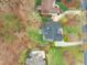 An aerial view of a well-maintained home featuring lush landscaping and a private driveway at 1188 The Preserve Trl, Chapel Hill, NC 27517