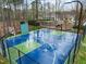 A community basketball court with colorful surfacing and well-maintained fencing, perfect for recreation at 1188 The Preserve Trl, Chapel Hill, NC 27517