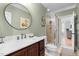 Well-lit bathroom with a shower featuring updated tile and modern finishes at 1188 The Preserve Trl, Chapel Hill, NC 27517