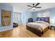 Bright bedroom featuring a wooden bed frame, ceiling fan, and window seat at 1188 The Preserve Trl, Chapel Hill, NC 27517