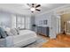 Bright bedroom with hardwood floors, bay windows, and elegant furnishings at 1188 The Preserve Trl, Chapel Hill, NC 27517