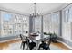 Bright dining room with large windows, modern decor, and a hardwood floor at 1188 The Preserve Trl, Chapel Hill, NC 27517