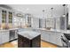Spacious kitchen with stainless steel appliances, granite counters, and hardwood floors at 1188 The Preserve Trl, Chapel Hill, NC 27517