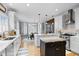 Modern kitchen with custom cabinets, stainless steel appliances, and a large center island at 1188 The Preserve Trl, Chapel Hill, NC 27517