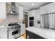 Gourmet kitchen featuring stainless steel appliances, a gas range, and custom cabinetry at 1188 The Preserve Trl, Chapel Hill, NC 27517