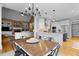 Eat-in kitchen with modern appliances, a center island, a dining area, and an open layout at 1188 The Preserve Trl, Chapel Hill, NC 27517
