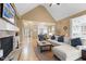 Spacious living room with a stone fireplace, hardwood floors, and an open layout at 1188 The Preserve Trl, Chapel Hill, NC 27517