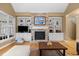 Cozy living room featuring a stone fireplace, built-in shelving, and comfortable seating at 1188 The Preserve Trl, Chapel Hill, NC 27517