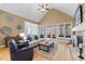 Bright living room with hardwood floors, a stone fireplace, and a comfortable sectional sofa at 1188 The Preserve Trl, Chapel Hill, NC 27517