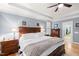Comfortable bedroom featuring hardwood floors, neutral colors, and a ceiling fan at 1188 The Preserve Trl, Chapel Hill, NC 27517
