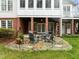 Cozy patio setup with comfortable seating around a fire pit, creating an inviting space for outdoor gatherings and relaxation at 1188 The Preserve Trl, Chapel Hill, NC 27517