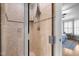 Close-up of tiled shower, with a glass door, featuring modern fixtures at 1188 The Preserve Trl, Chapel Hill, NC 27517