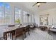 Inviting sunroom featuring an outdoor dining area, lots of natural light, and a ceiling fan at 1188 The Preserve Trl, Chapel Hill, NC 27517