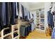 Organized walk-in closet with custom shelving and ample storage space for clothing and shoes at 1188 The Preserve Trl, Chapel Hill, NC 27517