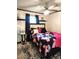 Inviting bedroom with dark accents, floral bedding, and ample natural light at 1209 Mill Valley Rd, Fuquay Varina, NC 27526