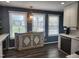 Kitchen area with rustic island, dark wood floors, and modern appliances at 1209 Mill Valley Rd, Fuquay Varina, NC 27526