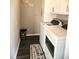 Bright laundry room with washer, dryer, storage cabinets, and decorative accents at 1209 Mill Valley Rd, Fuquay Varina, NC 27526