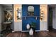Sophisticated living room featuring custom built-ins, unique decor, and ample natural light at 1209 Mill Valley Rd, Fuquay Varina, NC 27526