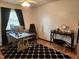 Home office setup with modern computer, stylish desk and comfortable seating area at 1209 Mill Valley Rd, Fuquay Varina, NC 27526