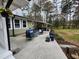Covered patio boasting outdoor seating and a grill, perfect for entertaining at 1209 Mill Valley Rd, Fuquay Varina, NC 27526