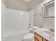 Bathroom featuring combination tub and shower and marble vanity at 1220 Bethlehem Rd, Knightdale, NC 27545