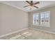 Bedroom features neutral carpet, ceiling fan and shuttered windows at 1220 Bethlehem Rd, Knightdale, NC 27545