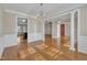 Elegant dining room showcasing hardwood floors, columns, and a beautiful chandelier at 1220 Bethlehem Rd, Knightdale, NC 27545