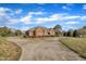 Charming brick home with a long driveway and beautiful landscaping, offering a welcoming curb appeal at 1220 Bethlehem Rd, Knightdale, NC 27545