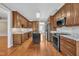 Modern kitchen with granite countertops, custom cabinets, and stainless steel appliances at 1220 Bethlehem Rd, Knightdale, NC 27545