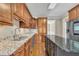 Bright kitchen with granite counters, custom cabinets, and stainless steel appliances at 1220 Bethlehem Rd, Knightdale, NC 27545