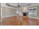 Large living room with hardwood floors, fireplace and a ceiling fan at 1220 Bethlehem Rd, Knightdale, NC 27545