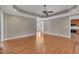 Open living room with hardwood floors and a ceiling fan at 1220 Bethlehem Rd, Knightdale, NC 27545