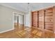 Bright living room with hardwood floors, chandelier, and custom built-in shelving at 1220 Bethlehem Rd, Knightdale, NC 27545