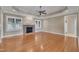Spacious living room features hardwood floors, fireplace and ceiling fan at 1220 Bethlehem Rd, Knightdale, NC 27545