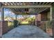 Covered patio with a brick pergola offering a view of the backyard at 1220 Bethlehem Rd, Knightdale, NC 27545
