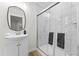 Modern bathroom with glass shower, sleek vanity, and gray and white decor at 123 E Weatherspoon St, Sanford, NC 27330