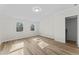 Inviting bedroom with bright light, wood floors, and neutral colors at 123 E Weatherspoon St, Sanford, NC 27330