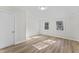 Inviting bedroom with bright light, wood floors, and neutral colors at 123 E Weatherspoon St, Sanford, NC 27330