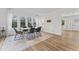 Elegant dining room with large windows, modern lighting, and stylish decor at 123 E Weatherspoon St, Sanford, NC 27330