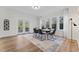 Bright dining room featuring modern lighting, ample windows, and stylish decor at 123 E Weatherspoon St, Sanford, NC 27330