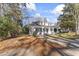 Charming home with inviting front porch and column beams in the front yard at 123 E Weatherspoon St, Sanford, NC 27330