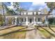 Inviting two-story home featuring a covered front porch with classic columns and manicured front yard at 123 E Weatherspoon St, Sanford, NC 27330