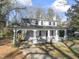 Stylish two-story home with a spacious covered porch and beautifully landscaped surroundings at 123 E Weatherspoon St, Sanford, NC 27330